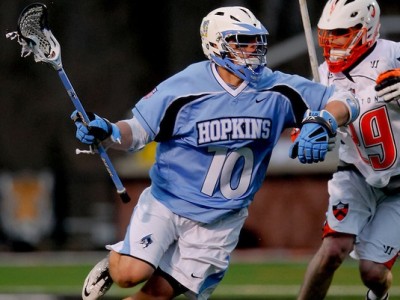 Mar 2, 2012; Princeton, NJ, USA;  John Hopkins Blue Jays midfielder Greg Edmonds (10) drives to the goal against Princeton Tigers midfielder Chris White (29) at Princeton.  Mandatory Credit: Jim O'Connor-US PRESSWIRE